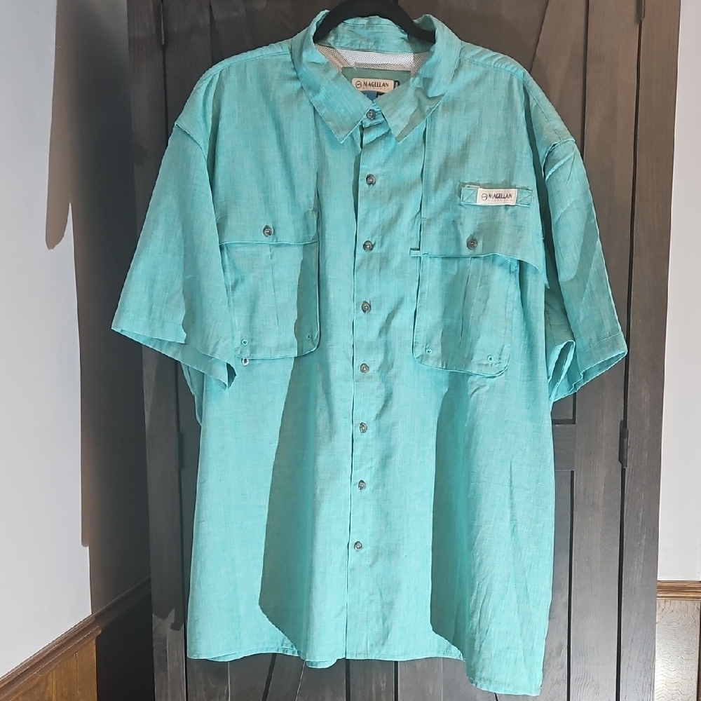 Magellan Outdoors Men's Green Short Sleeve Shirt with A textured Print.